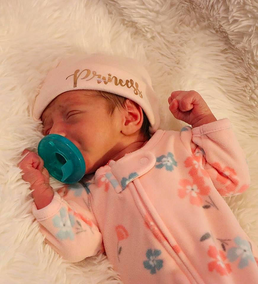 Raelynn Norris is registered to the contest to win money with this photo: animal_product, baby, baby_products, baby_toddler_clothing, child, fur, hair_accessory, headband, hearing, natural_material, nightwear, person, product, textile, toddler