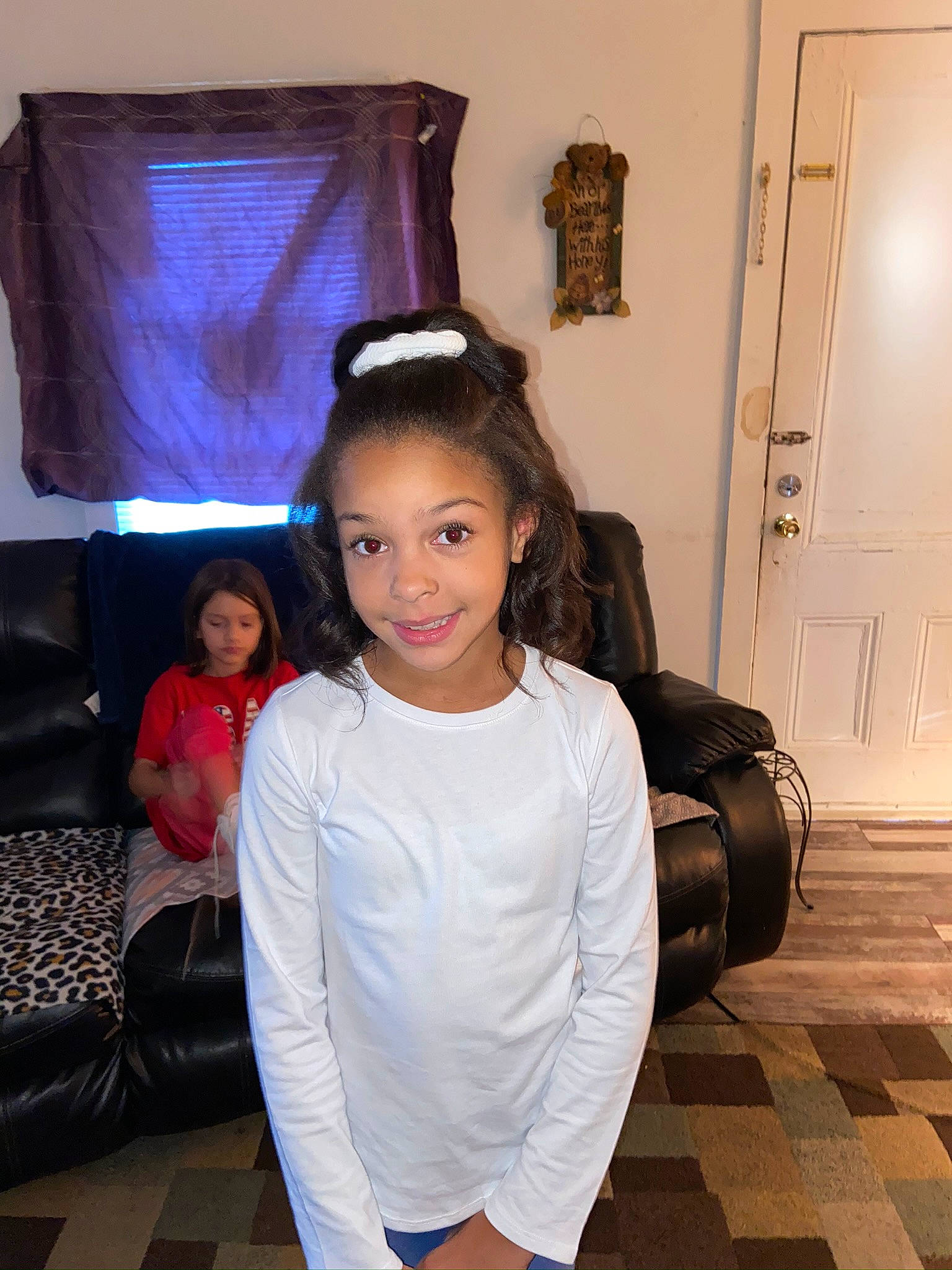 Ajanae is registered to the contest to win money with this photo: baggage, comfort, couch, door, floor, flooring, hair, hairstyle, home_door, interior_design, joy, living_room, long_hair, long_sleeved_t_shirt, person, room, shoulder, throat