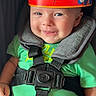 Stetson joined the competition — help win amazing prizes! baby, child, smiling, portrait, car_seat, safety_harness, crown, dragon_ball, anime, green_shirt, shorts, seated, indoors, close_up, happy, face, eyes, cheeks, infant, photography
