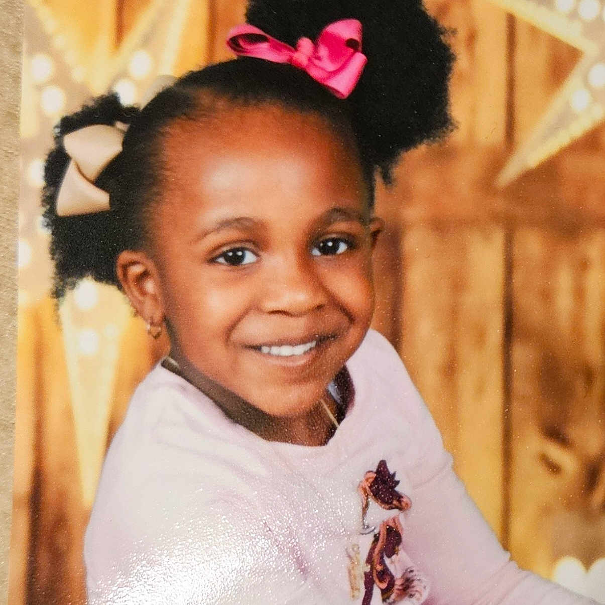 Madilyn is registered to the contest to win money with this photo: accessories, blackhair, child, clothing, dress, earring, face, female, girl, hair, happy, head, jewelry, laughing, necklace, person, photography, portrait, purple, smile