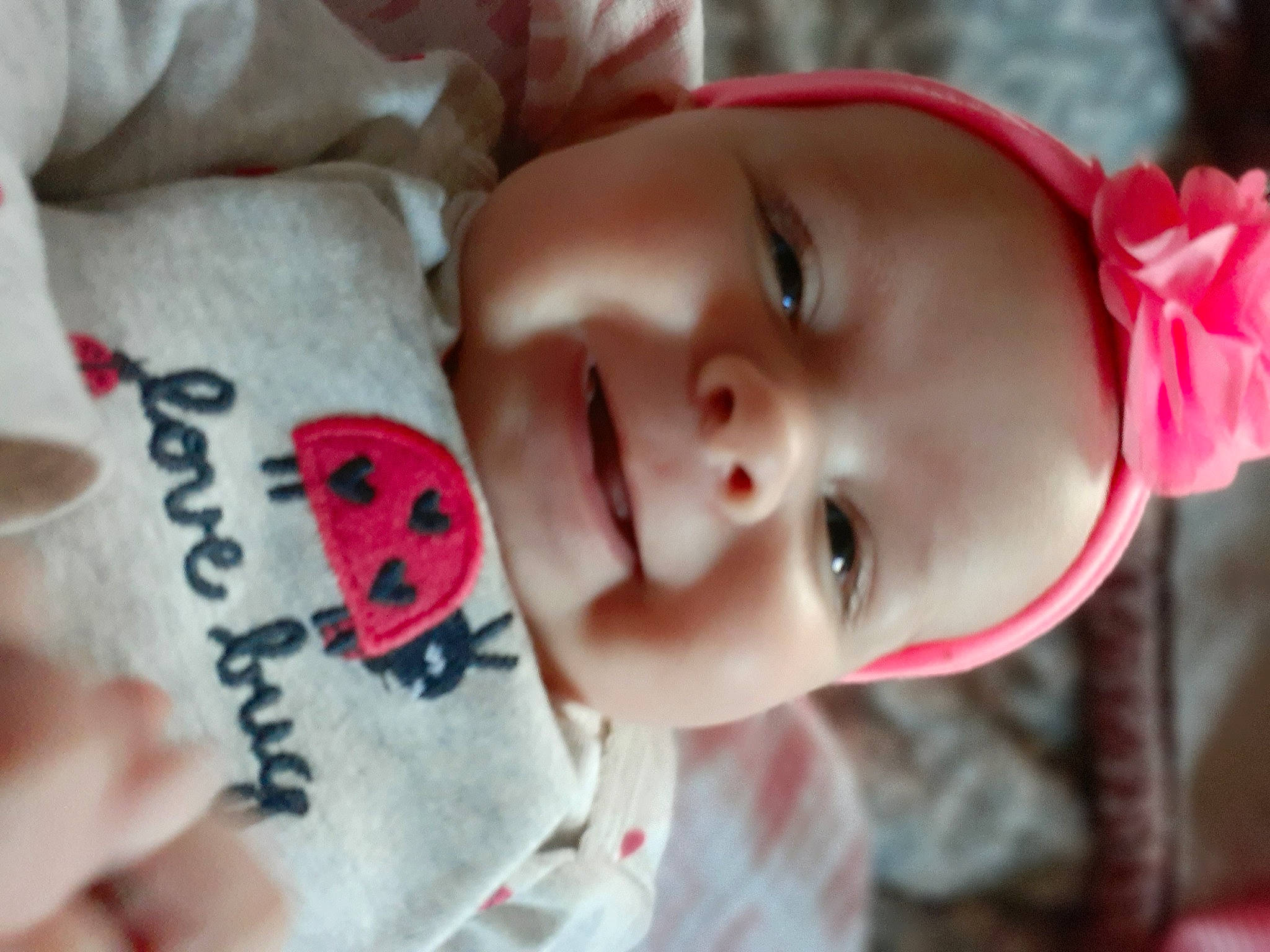 October is registered to the contest to win money with this photo: baby, cheek, chin, eye, eyebrow, eyelash, facial_expression, happy, hat, headwear, human, iris, lip, mammal, mouth, nose, person, photograph, pink, skin