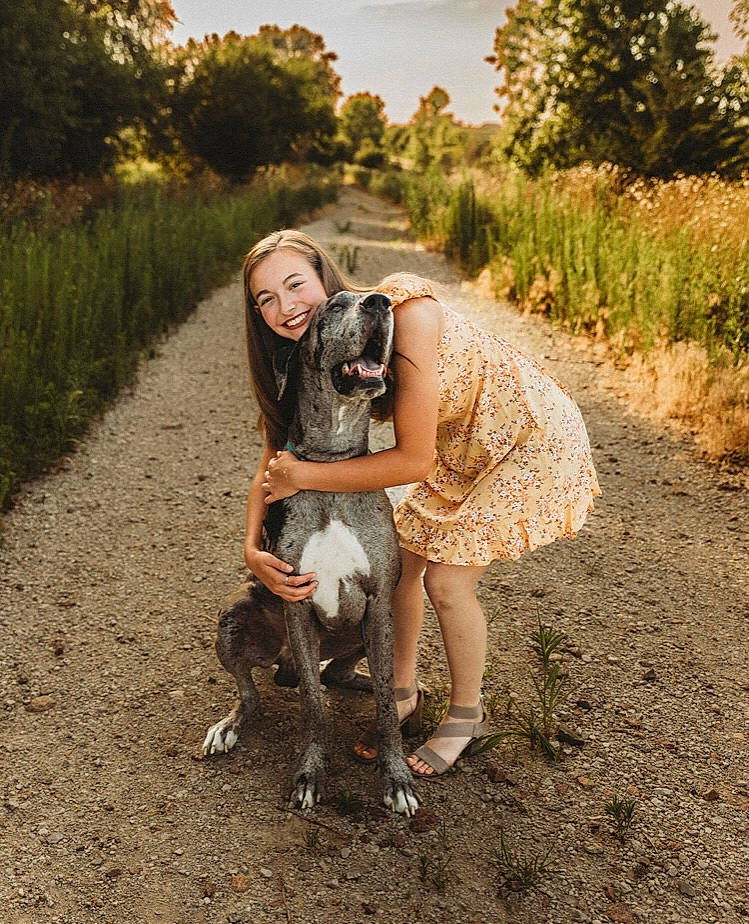 Waylon James is registered to the contest to win money with this photo: blond, boot, brown_hair, cowboy_boot, dress, eyewear, fawn, flash_photography, grass, grassland, happy, human_leg, landscape, people_in_nature, plant, sandal, smile, sunlight, tree, wood