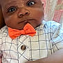 baby, infant, face, bow_tie, shirt, hand, fist, closeup, portrait, child, expression, clothing, indoors, skin, young, cute, person, newborn, fashion, casual