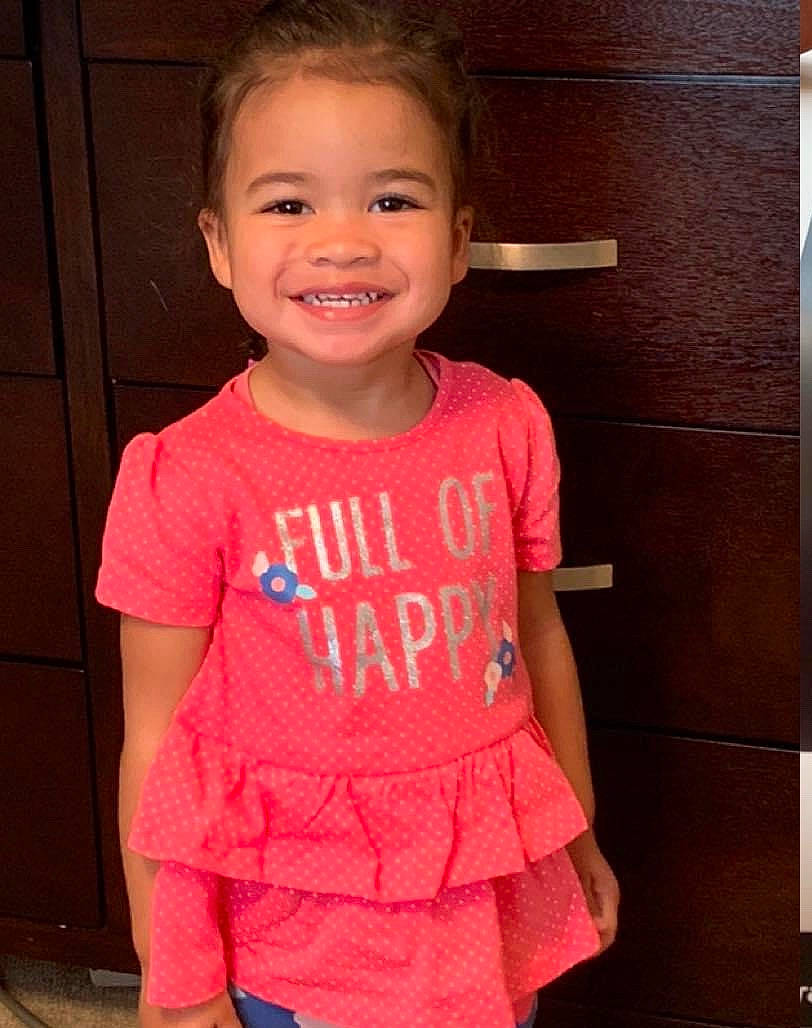 Kadence is registered to the contest to win money with this photo: baby_toddler_clothing, cheek, child, child_model, clothing, face, joy, magenta, person, pink, shoulder, skin, sleeve, smile, standing, t_shirt, toddler, top, vacation