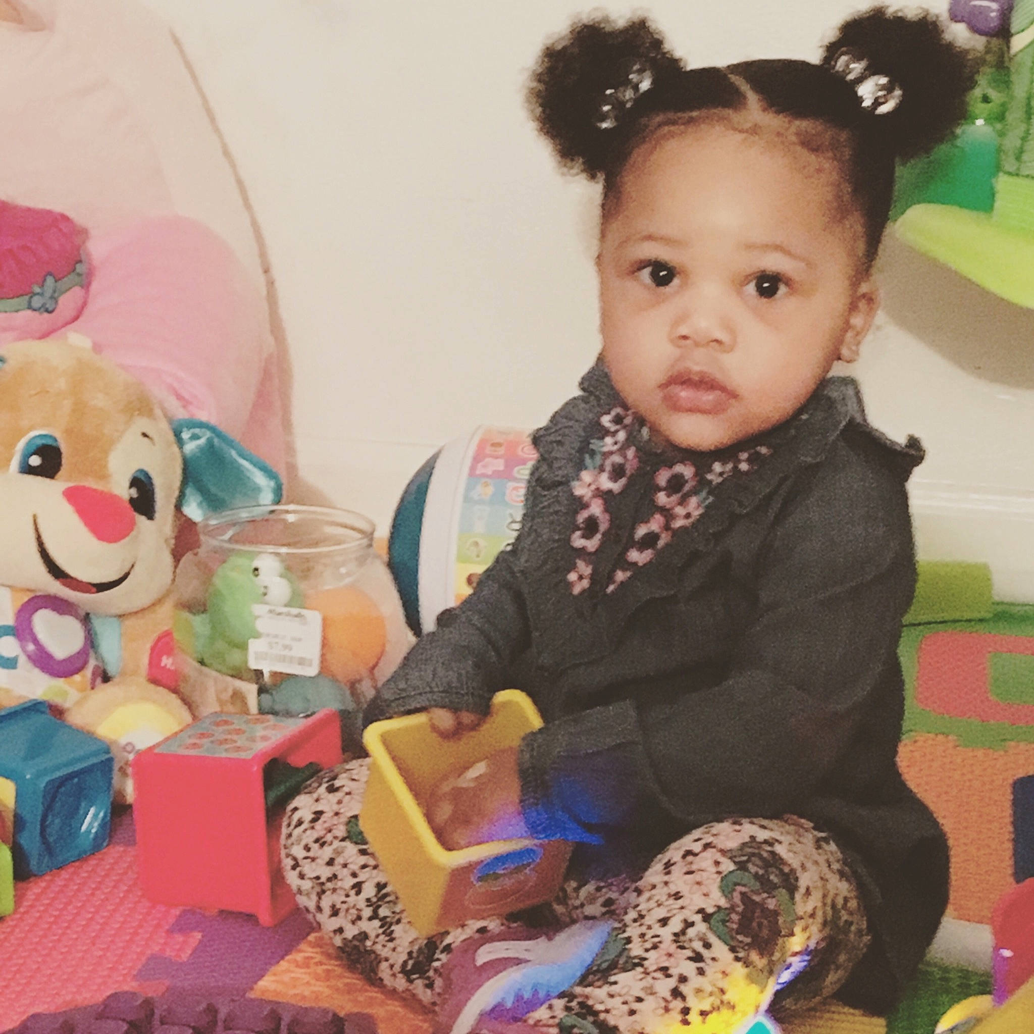 Daenerys is registered to the contest to win money with this photo: baby, baby_toys, cheek, child, ear, eye, happy, head, kindergarten, organ, party, person, pink, play, skin, smile, stuffed_toy, teddy_bear, toddler, toy