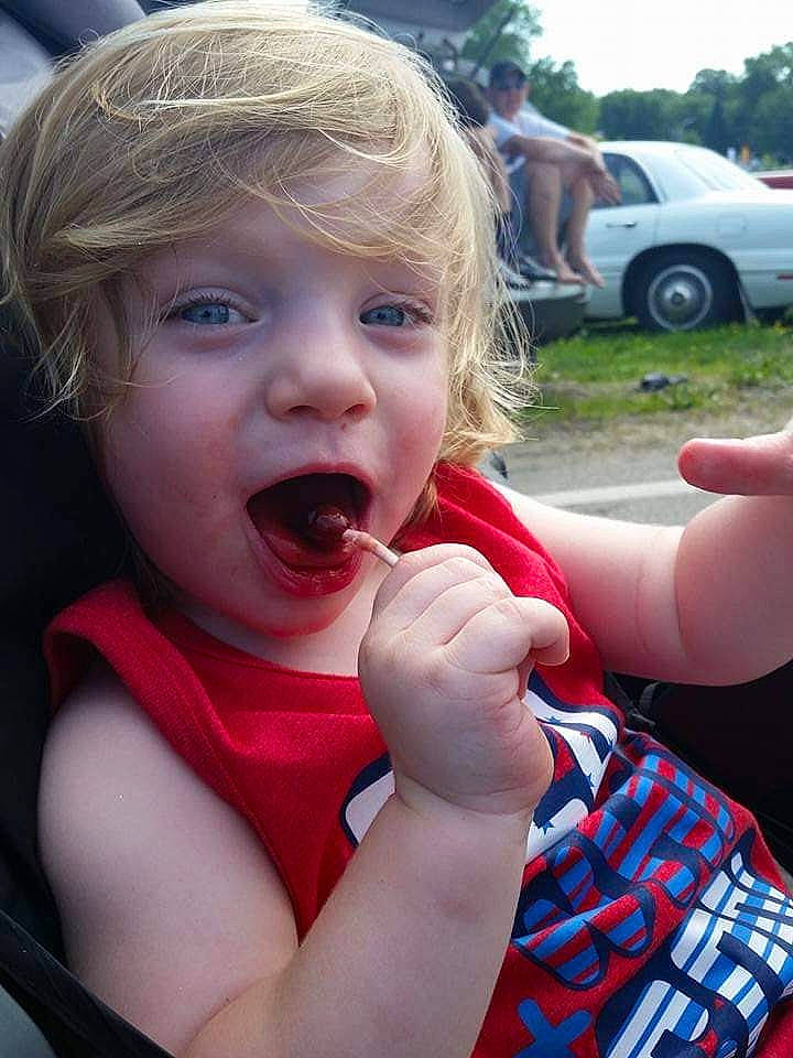 Patrick is registered to the contest to win money with this photo: cheek, eyelash, finger, fun, gesture, grass, happy, iris, leisure, lip, mouth, nose, person, pink, plant, skin, summer, tire, toddler, tree