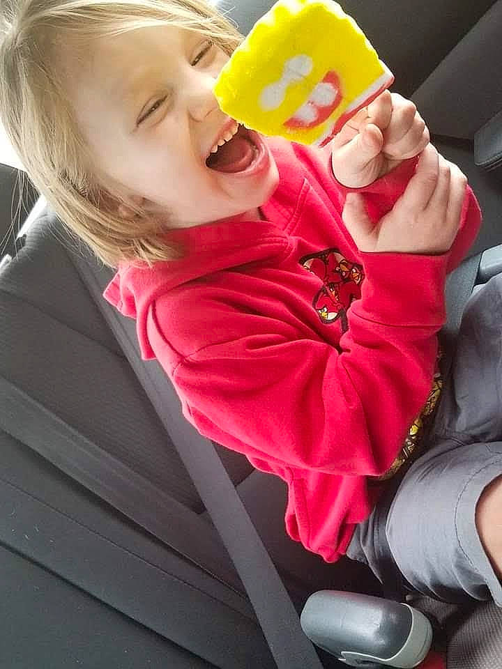 Patrick is registered to the contest to win money with this photo: baby, baby_products, baby_toddler_clothing, carmine, cheek, child, comfort, drinkware, face, finger, fun, happy, human_leg, leisure, magenta, mouth, nose, person, pink, thigh