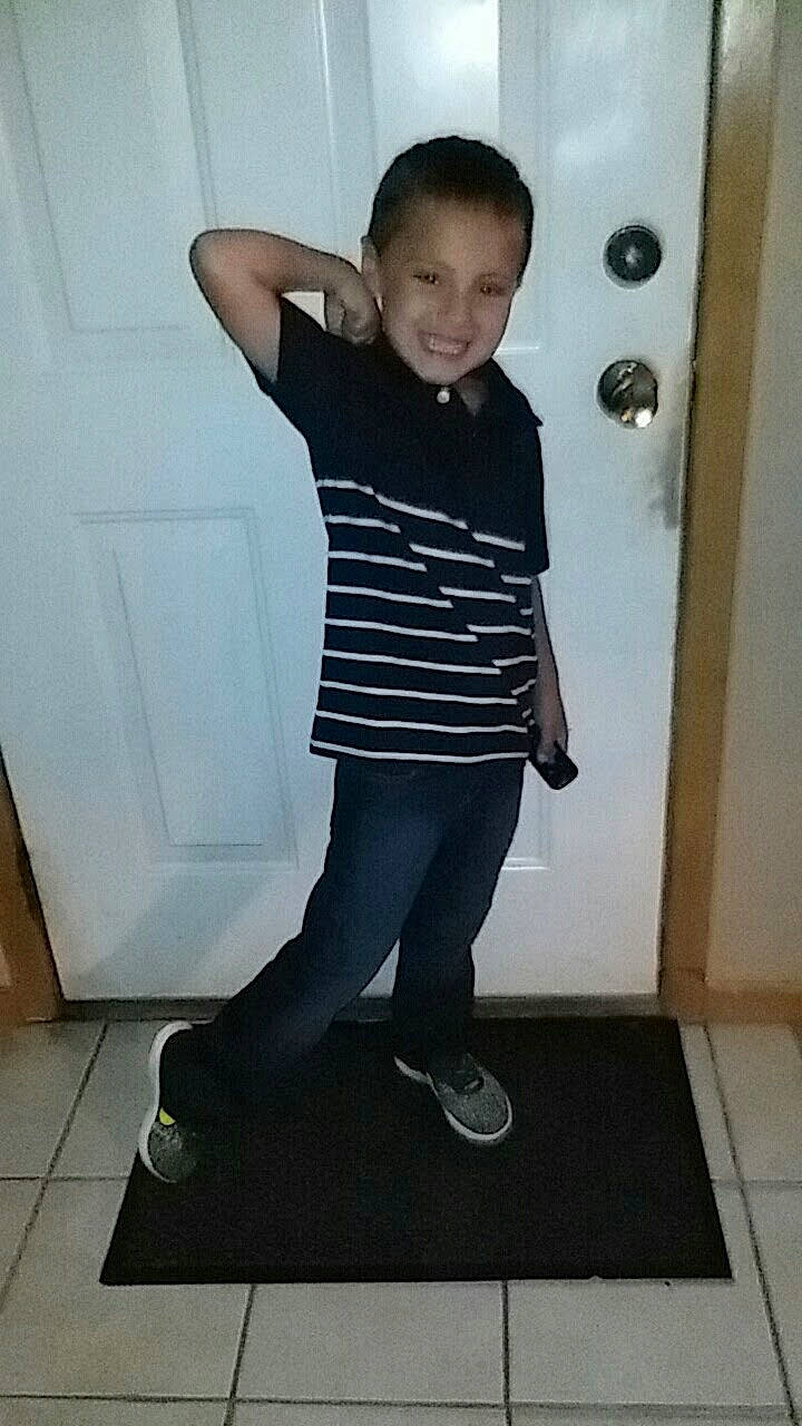 Caleb is registered to the contest to win money with this photo: arm, denim, elbow, electric_blue, fashion_accessory, fashion_design, fun, gesture, human_leg, joy, knee, leg, pattern, person, sleeve, smile, stairs, standing, t_shirt, thigh