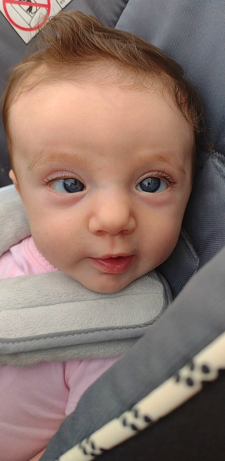 Maggie joined the competition — help win amazing prizes! baby, baby_products, baby_toddler_clothing, cheek, child, chin, close_up, comfort, eyebrow, eyelash, iris, linens, lip, no_expression, nose, person, portrait_photography, sitting, skin, sleeve