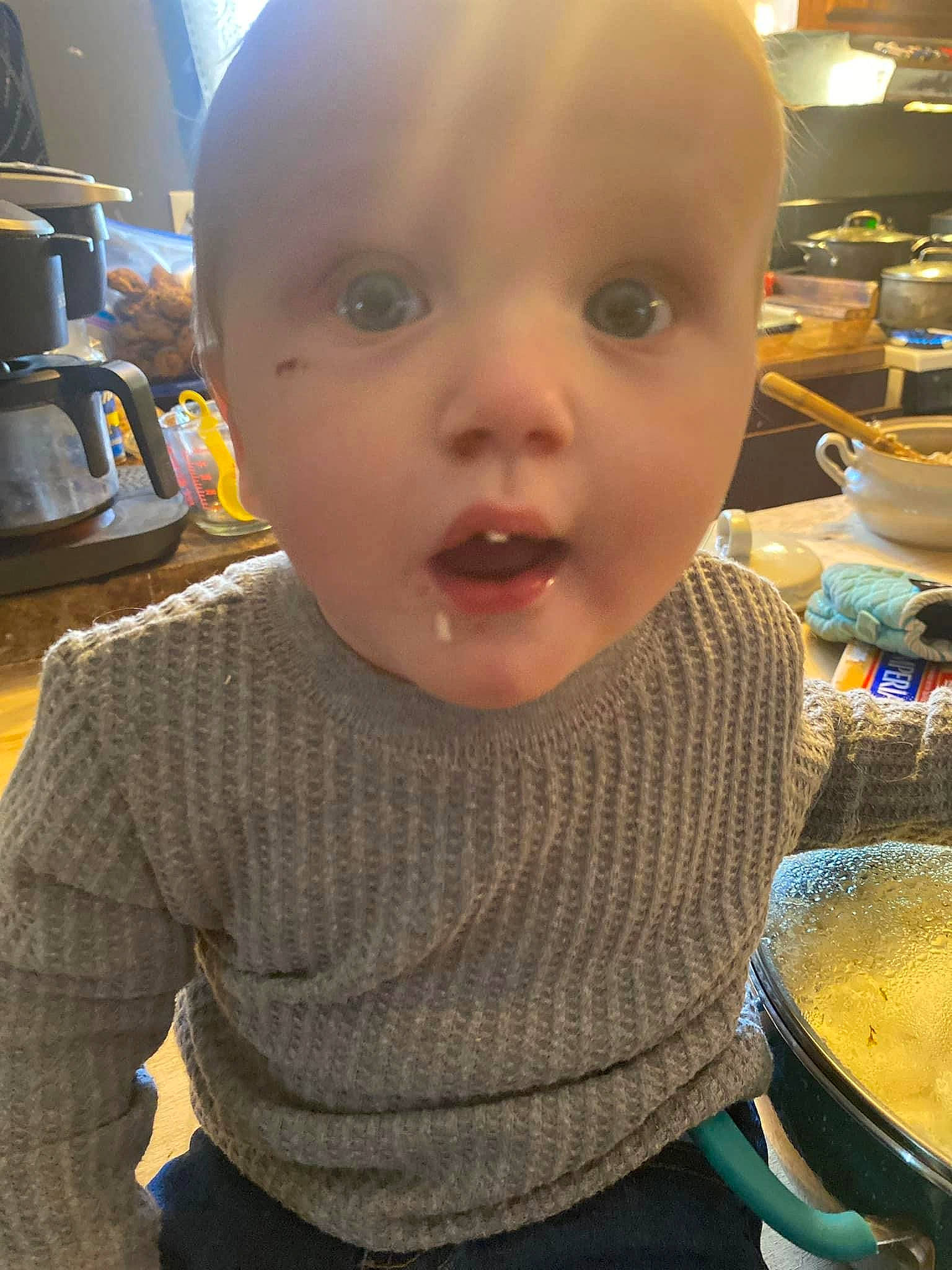 Desmond is registered to the contest to win money with this photo: baby, baby_toddler_clothing, cheek, child, coffeemaker, comfort_food, cooking, cuisine, eyelash, fun, home_appliance, ingredient, kitchen_appliance, mouth, natural_foods, nose, person, recipe, surprise, tableware