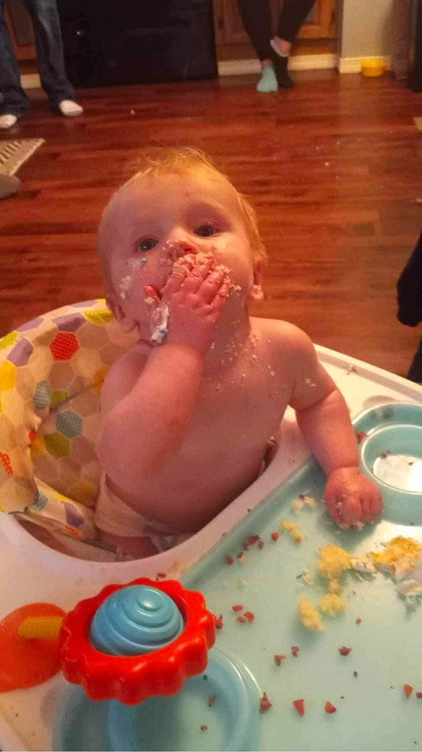 Desmond is registered to the contest to win money with this photo: baby, baby_food, baby_products, baby_toys, bathing, chair, chest, child, comfort_food, cooking, event, fun, icing, mouth, party, person, play, sugar_paste, sweetness, toddler