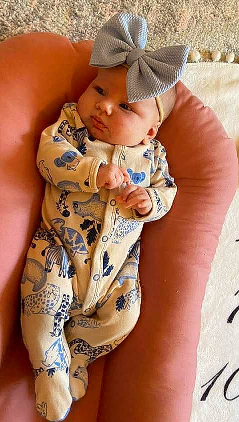 Honey is registered to the contest to win money with this photo: abdomen, arm, baby, baby_sleeping, baby_toddler_clothing, chest, elbow, finger, hand, head, headgear, headwear, human_body, human_leg, joint, leg, neck, person, skin, stomach