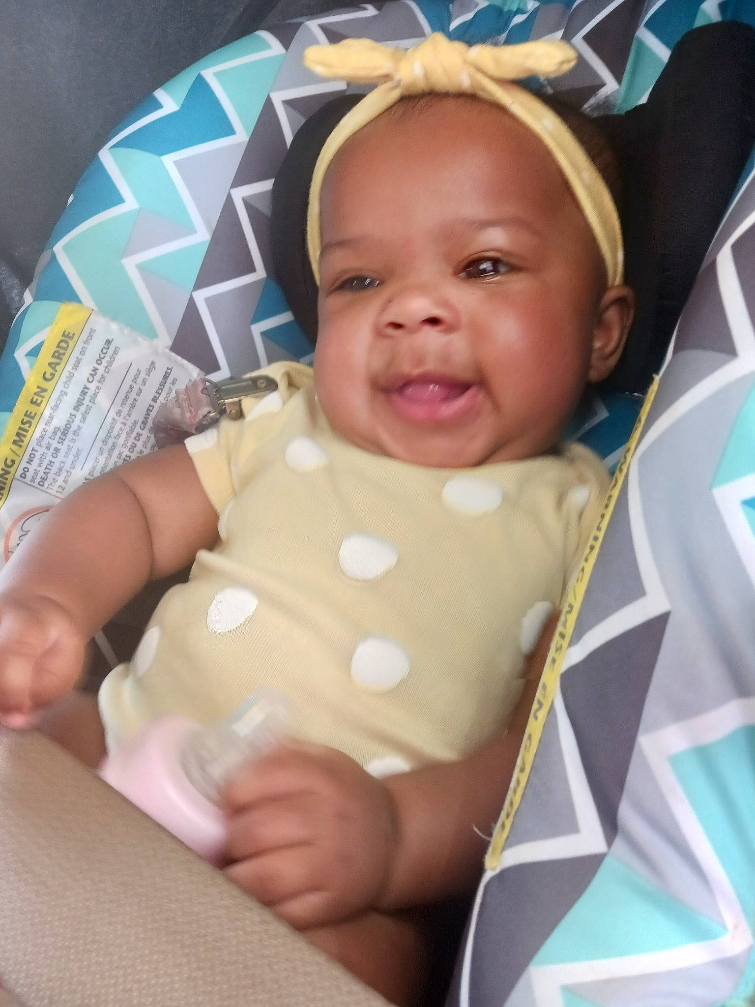 De'Janae is registered to the contest to win money with this photo: baby, baby_products, baby_safety, baby_toddler_clothing, cheek, child, comfort, event, facial_expression, fun, happy, linens, pattern, person, room, sitting, skin, sleeve, smile, textile