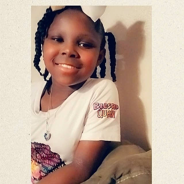 De'Asia is registered to the contest to win money with this photo: audio_equipment, braid, child, cool, eyebrow, eyelash, face, fashion_accessory, flash_photography, font, happy, joy, pattern, person, portrait_photography, selfie, sitting, sleeve, smile, t_shirt