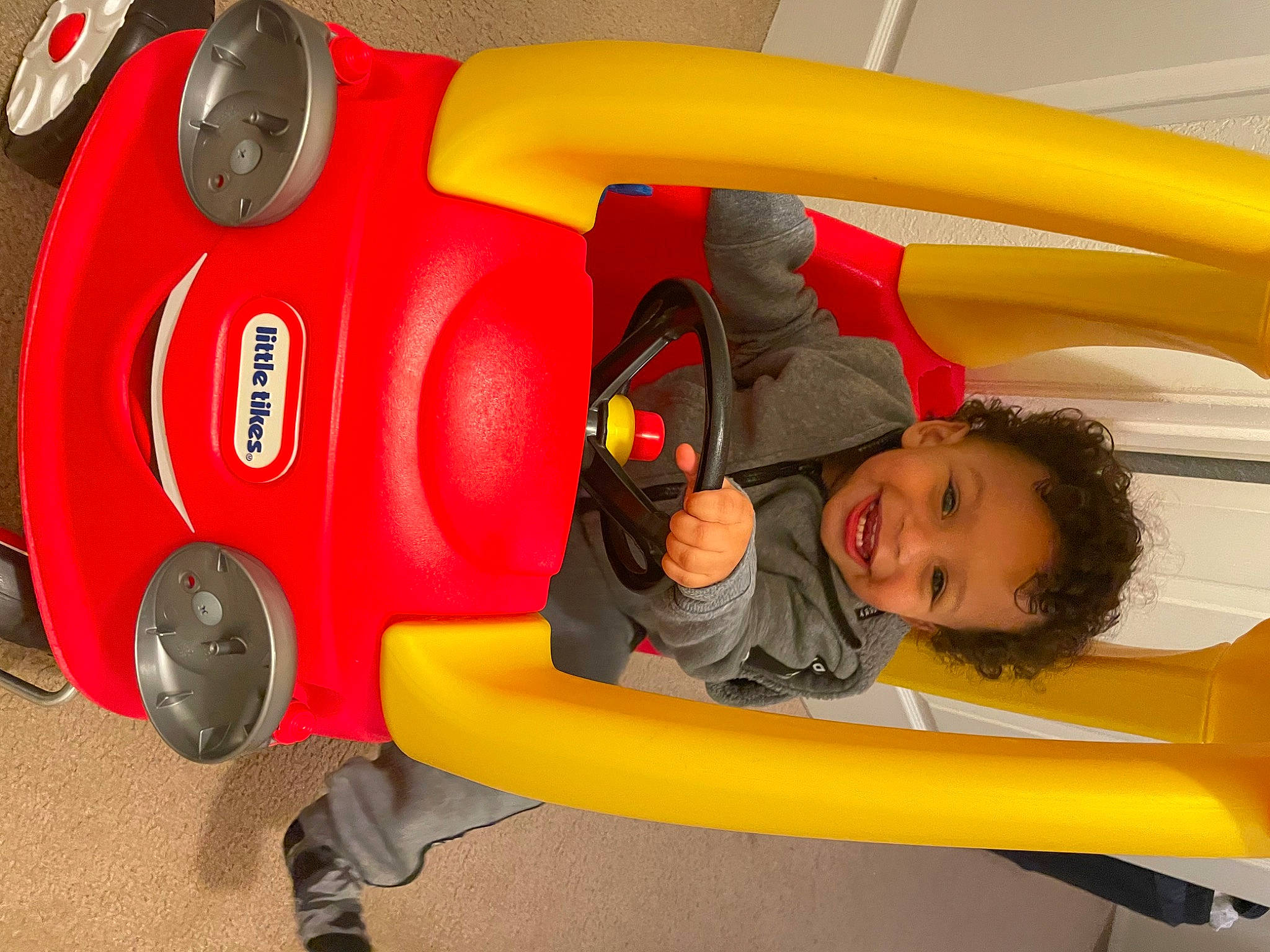 Jaeden joined the competition — help win amazing prizes! auto_part, automotive_design, automotive_exterior, automotive_lighting, bumper, car, fun, happy, joy, leisure, mode_of_transport, motor_vehicle, person, recreation, red, smile, tire, toddler, vehicle, vehicle_door