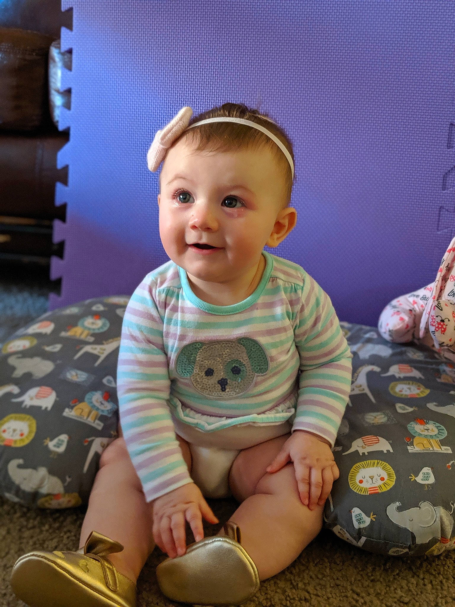Jessilyn is registered to the contest to win money with this photo: baby, cheek, child, ear, head, headband, headgear, leg, person, sitting, sleeve, smile, toddler
