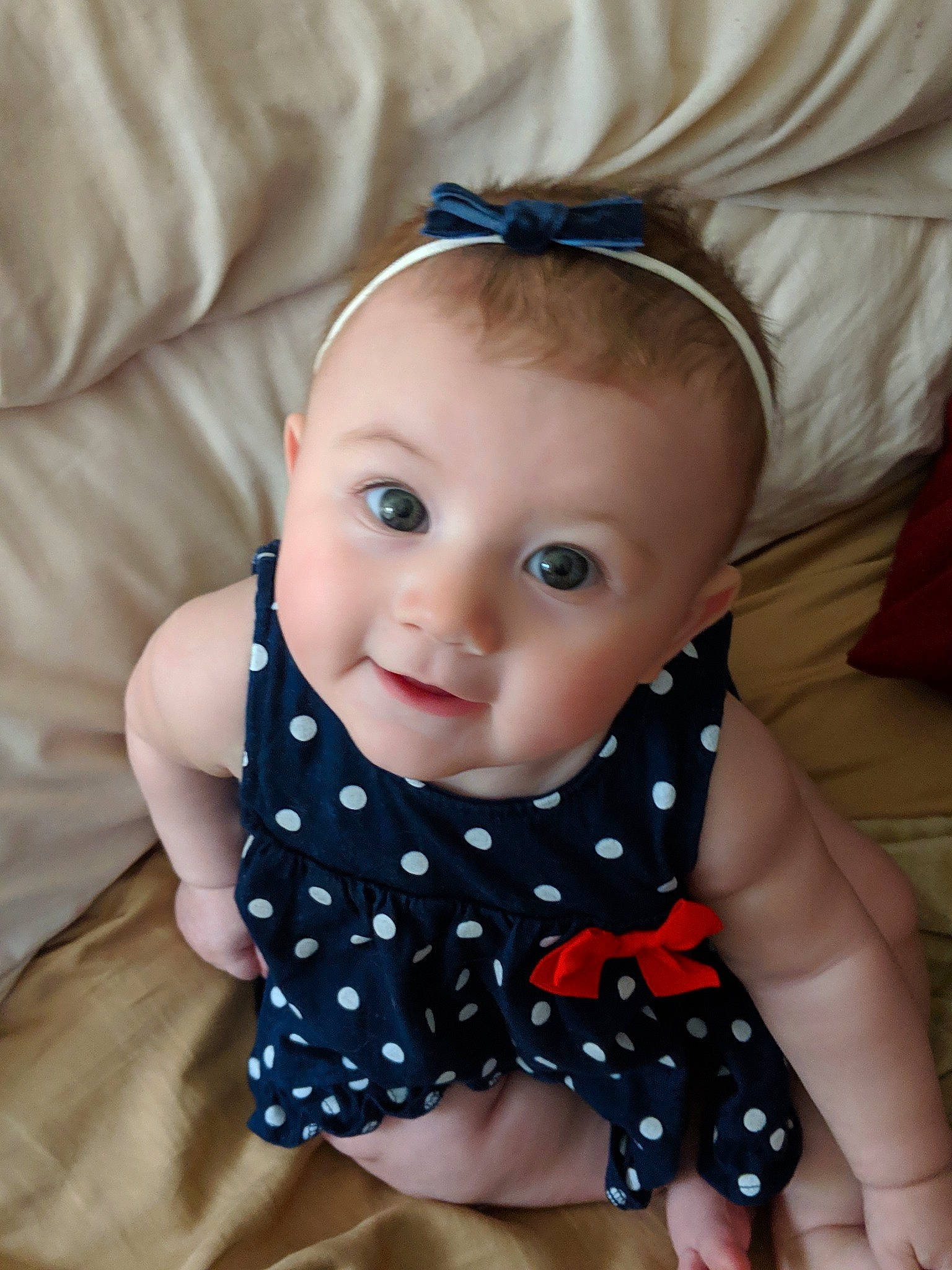 Jessilyn is registered to the contest to win money with this photo: baby, baby_toddler_clothing, cheek, child, design, hair_accessory, head, iris, lip, neck, pattern, person, polka_dot, skin, toddler