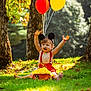 toddler, child, cake_smash, balloons, mouse_ears, red_suspender, yellow_frosting, messy, outdoor, grass, trees, sunlight, celebration, happy, playful, birthday, nature, smiling, fun, sitting