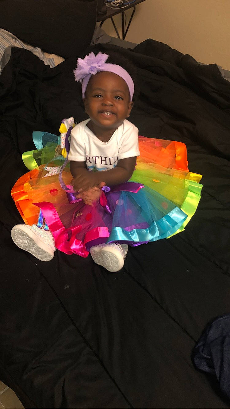 Emily is registered to the contest to win money with this photo: child, costume, joy, person, pink, toddler