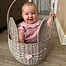 baby, basket, bunny, child, cute, floor, happy, home, indoors, person, pink_clothing, plush, smile, wicker, wood_floor, whiskers, ears, handle, cuteness, playful