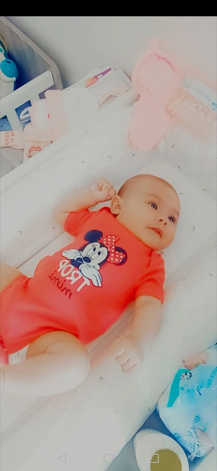 Elliannah participe au concours pour gagner de l'argent avec cette photo : baby, baby_products, baby_toddler_clothing, baby_toys, carmine, child, comfort, font, happy, linens, person, pink, room, sitting, sleeve, smile, stomach, t_shirt, textile, toddler