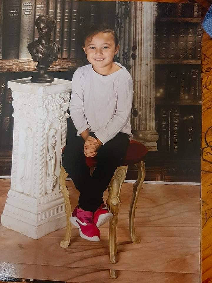 Kamora joined the competition — help win amazing prizes! barefoot, child, dress, flooring, foot, hardwood, human_leg, joy, knee, laminate_flooring, person, room, shorts, sitting, sleeve, smile, thigh, vintage_clothing, visual_arts, wood