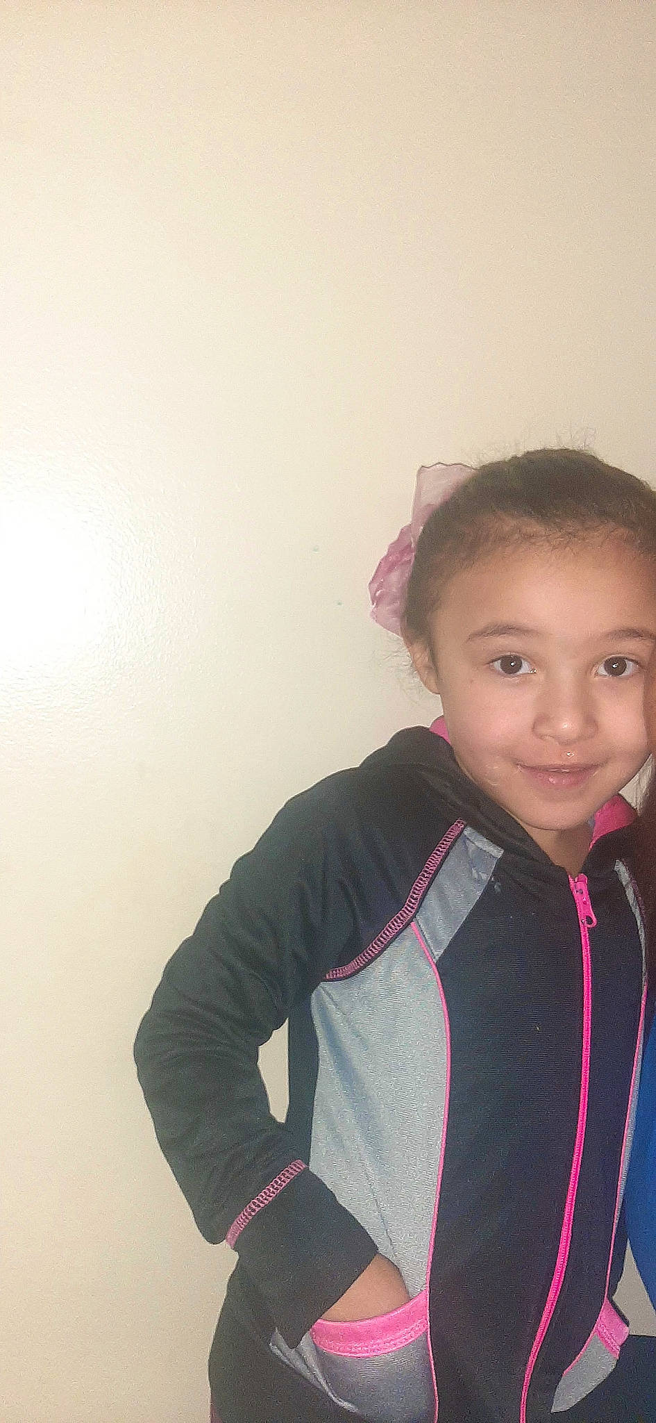 Kamora is registered to the contest to win money with this photo: black_hair, cheek, electric_blue, fashion_accessory, fun, gesture, happy, joy, lip, long_hair, magenta, neck, outerwear, person, personal_protective_equipment, shoulder, sleeve, smile, sportswear, standing