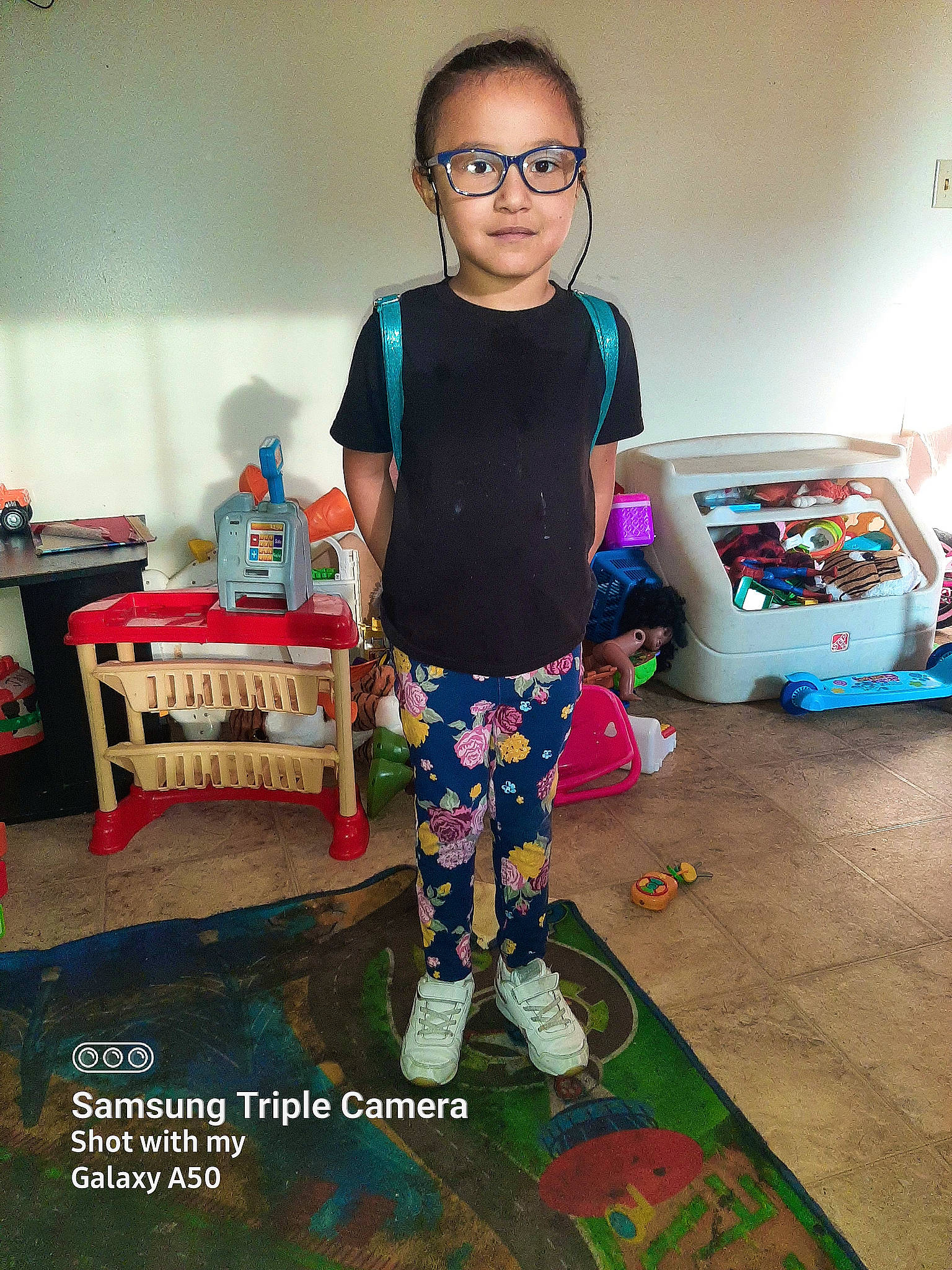 Kamora joined the competition — help win amazing prizes! baby_toddler_clothing, child, cool, electric_blue, event, eyewear, fashion_design, flooring, fun, glasses, happy, pattern, person, play, room, shorts, sitting, sleeve, t_shirt, textile