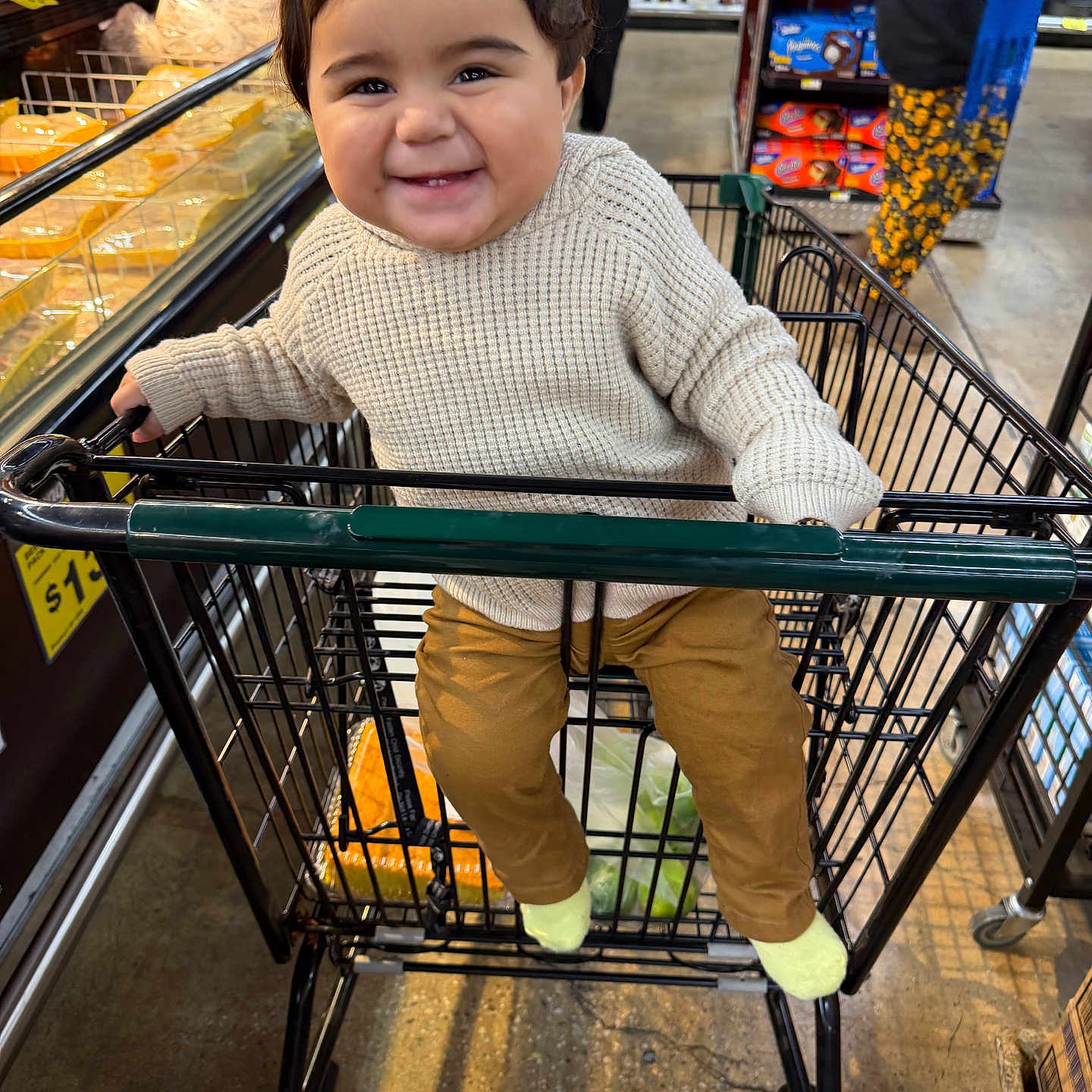 Illich joined the competition — help win amazing prizes! aisle, baby, cart, child, floor, food, grocery_store, happy, indoor, pants, people, person, products, retail, shoes, shopping_cart, smiling, store_shelf, sweater, toddler