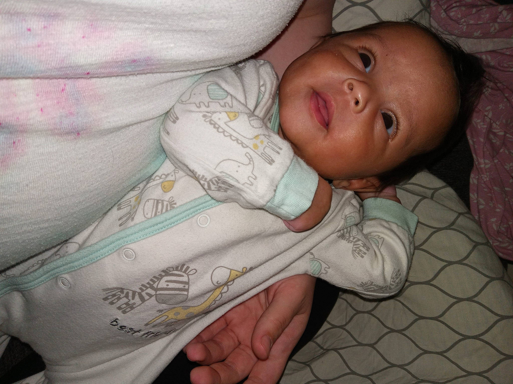 Taliyah is registered to the contest to win money with this photo: arm, baby, baby_toddler_clothing, cheek, chest, child, comfort, elbow, finger, hand, human_body, linens, mouth, nail, nose, pattern, person, room, skin, sleeve