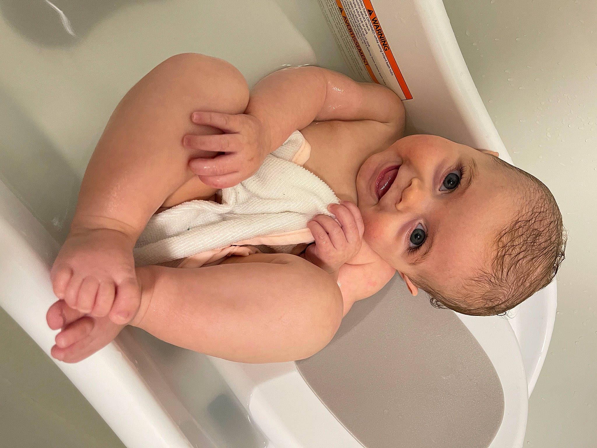 Emersyn is registered to the contest to win money with this photo: arm, baby, bathing, chest, child, comfort, elbow, eye, eyelash, finger, gesture, hand, human_body, joint, joy, leg, nail, person, skin, stomach