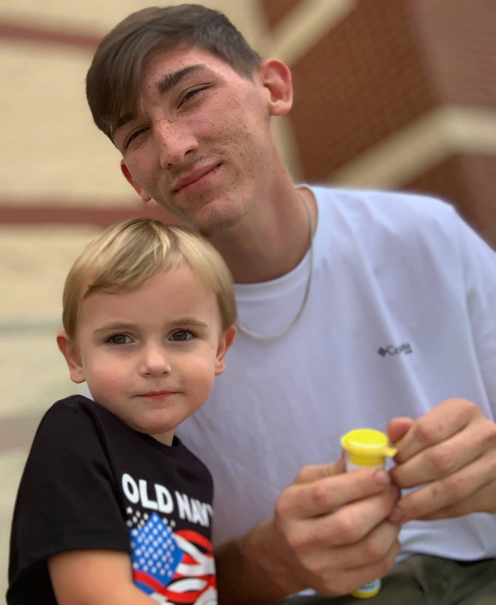 Caden is registered to the contest to win money with this photo: child, event, face, facial_expression, fun, gesture, hand, happy, head, human, joy, leisure, organ, people, person, product, recreation, smile, snapshot, t_shirt