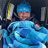 Giovanni joined the competition — help win amazing prizes! baby, smiling, blue_hat, blanket, car_seat, infant, clothing, happy, child, cute, cozy, portrait, indoor, seat, footwear, warm, face, person, toddler, blue