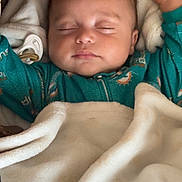 Giovanni joined the competition — help win amazing prizes! baby, sleeping, blanket, cozy, onesie, infant, peaceful, soft, warm, child, face, sleep, bedtime, comfort, rest, cute, portrait, indoor, hands, closed_eyes