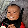 Giovanni joined the competition — help win amazing prizes! baby, child, smile, happy, food, face, car_seat, seatbelt, red_shirt, spider_web, hand, infant, cute, indoors, closeup, portrait, person, young_child, sitting, clothing