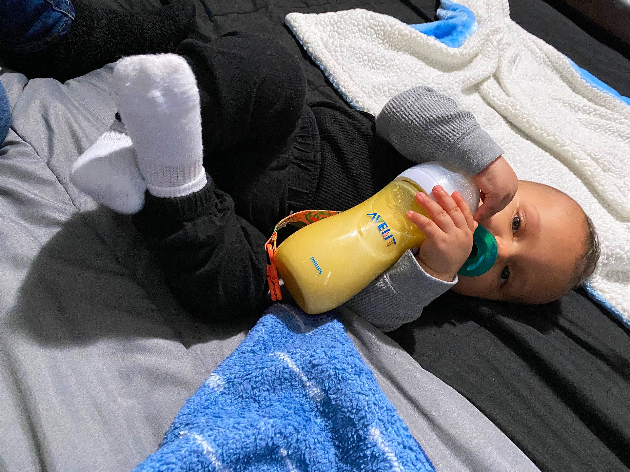 Jalen joined the competition — help win amazing prizes! baby_bottle, baby_products, bottle, denim, drink, drinking, glove, infant_formula, linens, person, plastic_bottle, safety_glove, sock, textile, wrist