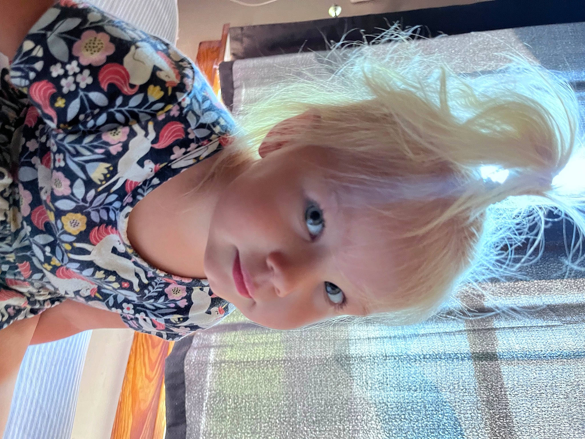 Lucy is registered to the contest to win money with this photo: bangs, beauty, blond, brown_hair, cheek, child, eyelash, flooring, fun, hair_coloring, happy, lip, long_hair, nose, pattern, person, plaid, sitting, skin, toddler