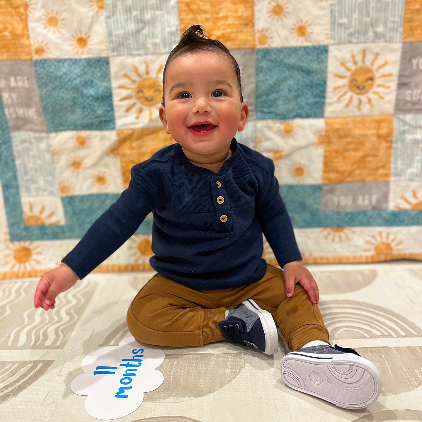 Davison joined the competition — help win amazing prizes! baby, bodypart, clothing, face, finger, footwear, happy, head, jeans, longsleeve, pants, person, photography, portrait, shoe, sitting, sleeve, smile, sneaker, wood