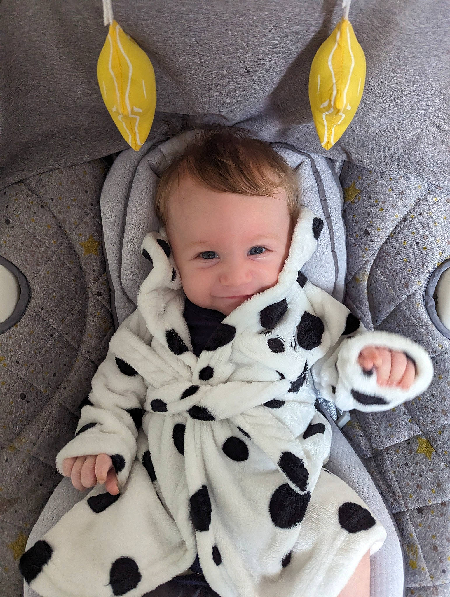 Noah joined the competition — help win amazing prizes! baby, baby_products, baby_toddler_clothing, child, collar, comfort, fashion_accessory, flooring, fur, happy, linens, outerwear, pattern, person, sitting, sleeve, t_shirt, toddler, white, wood