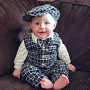 Wolf joined the competition — help win amazing prizes! baby, child, blue_eyes, checkered_outfit, bow_tie, hat, barefoot, couch, smiling, sitting, cute, infant, portrait, indoors, clothing, fashion, happy, person, young, cozy