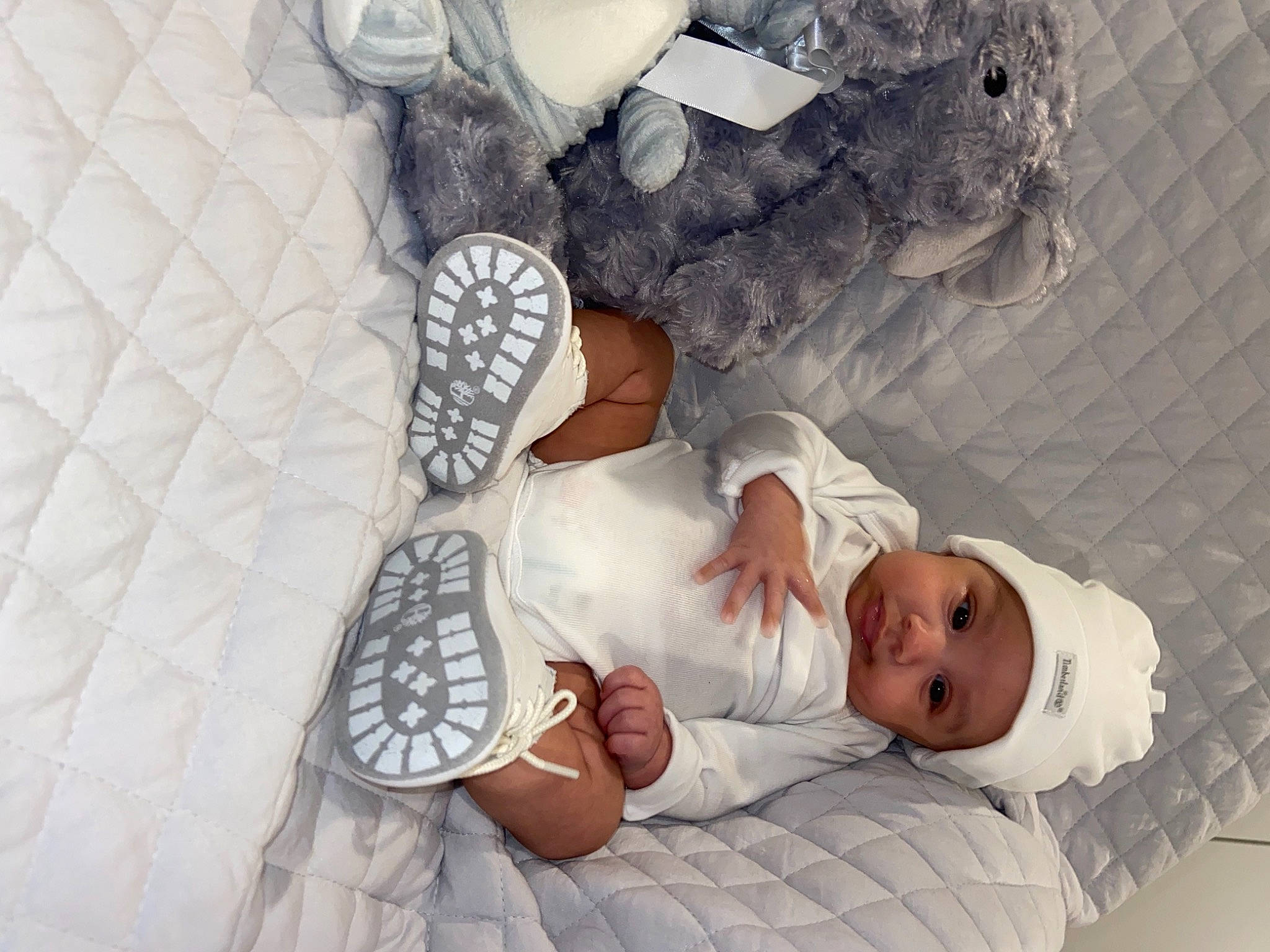 Andre joined the competition — help win amazing prizes! baby, baby_safety, baby_toddler_clothing, child, comfort, flip_flops, flooring, foot, gesture, hand, headwear, human_body, human_leg, leg, linens, pattern, person, room, textile, thumb