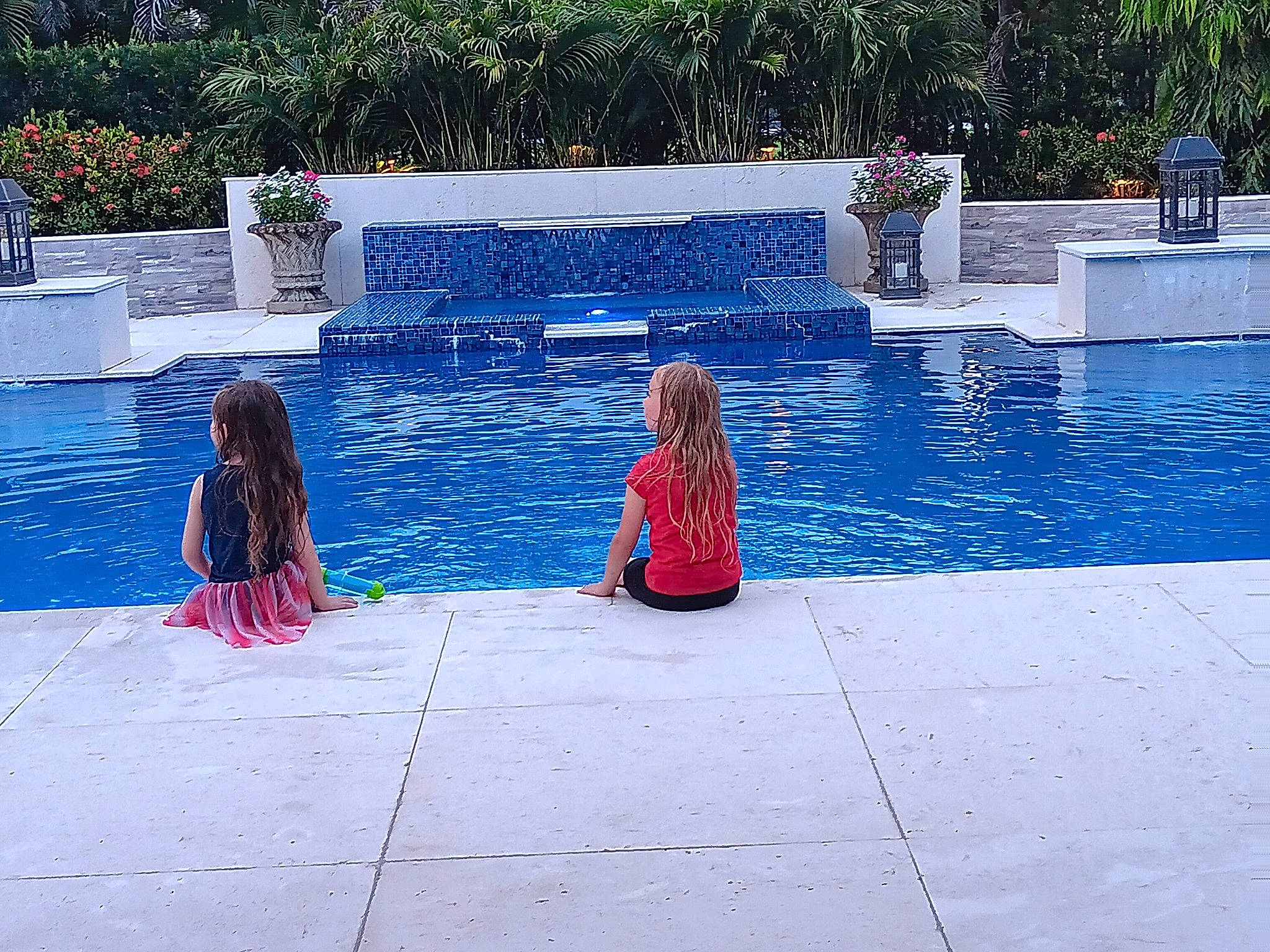 Mackenzie is registered to the contest to win money with this photo: aqua, azure, blue, composite_material, electric_blue, flooring, fun, leisure, leisure_centre, outdoor_furniture, person, plant, recreation, rectangle, resort_town, road_surface, sidewalk, swimming_pool, tourism, travel