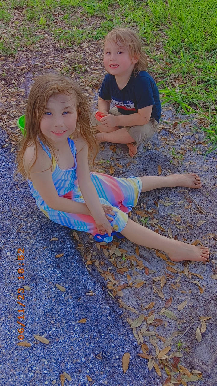 Mackenzie joined the competition — help win amazing prizes! child, electric_blue, foot, fun, grass, hair, happy, head, human_leg, joy, leaf, leisure, person, plant, recreation, shorts, sitting, smile, t_shirt, thigh