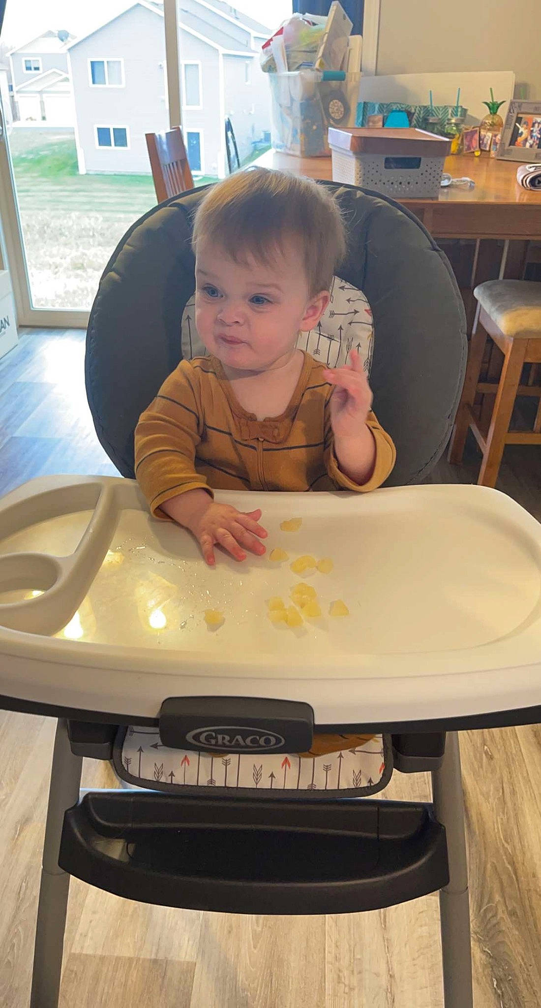 Malakai joined the competition — help win amazing prizes! automotive_exterior, baby, baby_toddler_clothing, bumper, chair, child, flooring, fun, furniture, gadget, leisure, person, play, product, room, sitting, t_shirt, table, toddler, wood