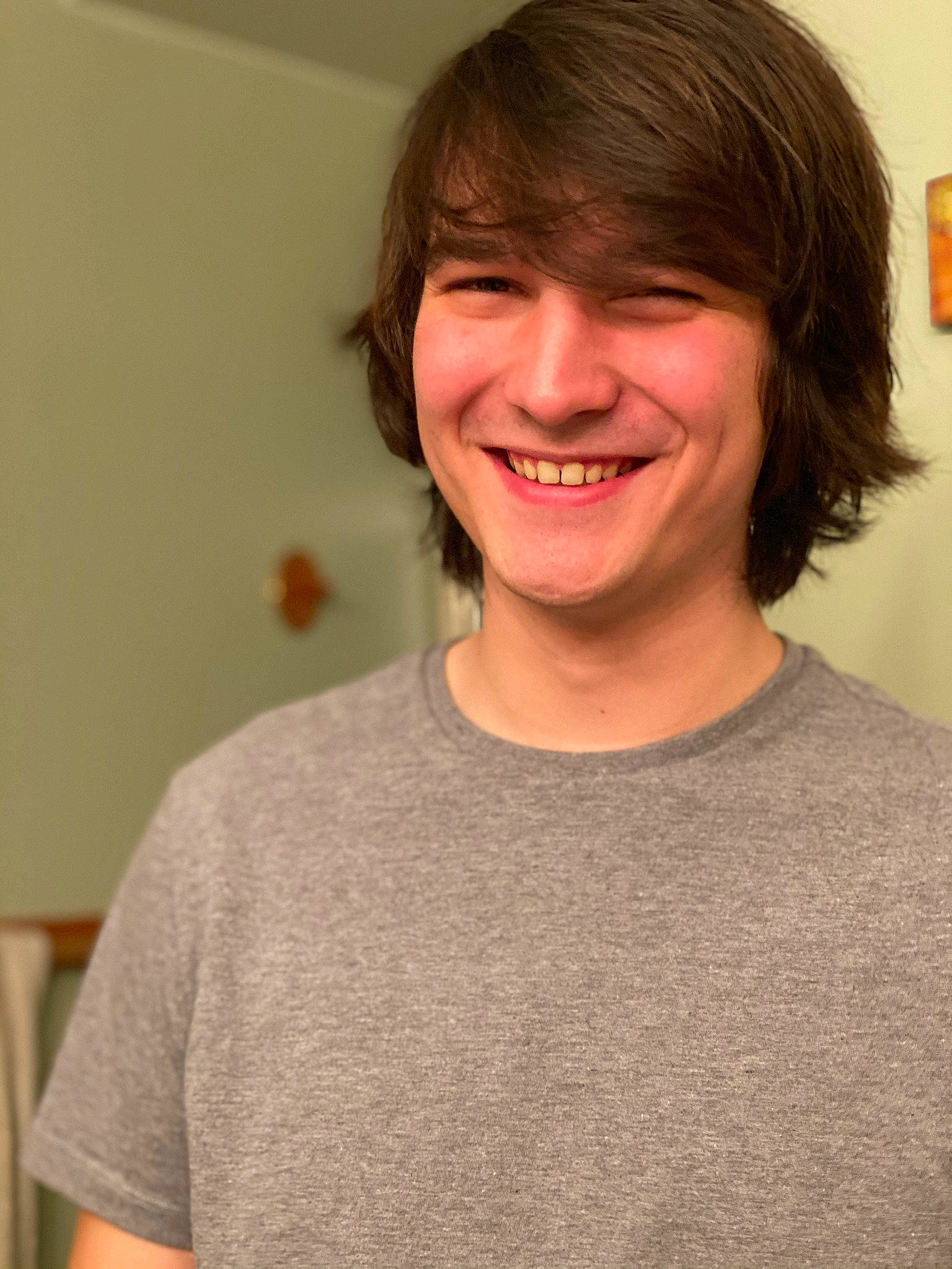Kevin joined the competition — help win amazing prizes! brown_hair, chin, face, facial_expression, facial_hair, forehead, hair, hairstyle, jaw, joy, long_hair, neck, person, shoulder, smile, t_shirt, tooth