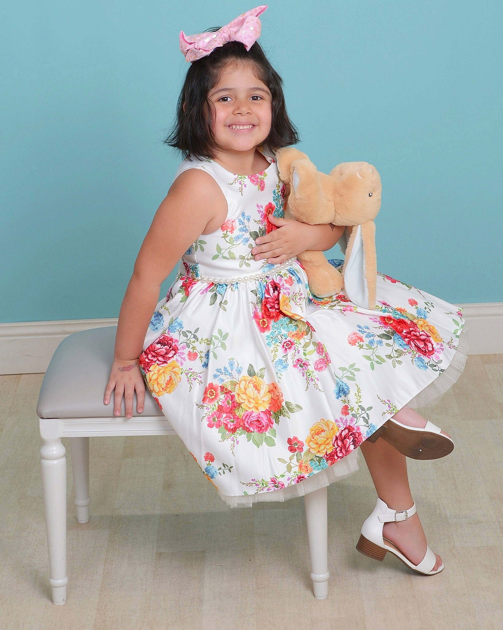 Athena is registered to the contest to win money with this photo: baby_toddler_clothing, beauty, clothing, day_dress, dress, event, face, fashion_design, hairstyle, happy, human_leg, joy, magenta, one_piece_garment, person, pink, sandal, skin, sleeve, smile