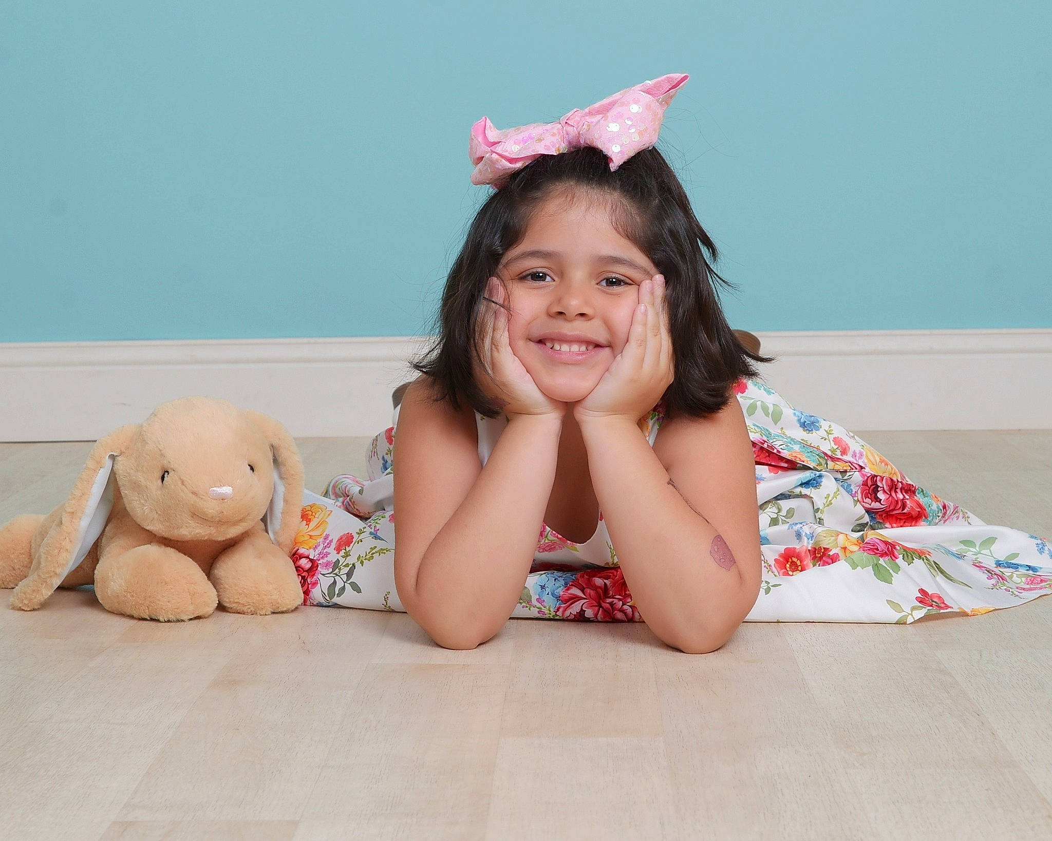 Athena is registered to the contest to win money with this photo: baby_playing_with_toys, bangs, child, comfort, finger, foot, fun, happy, human_leg, joy, leg, person, pink, sitting, skin, sleeve, smile, stuffed_toy, teddy_bear, thigh