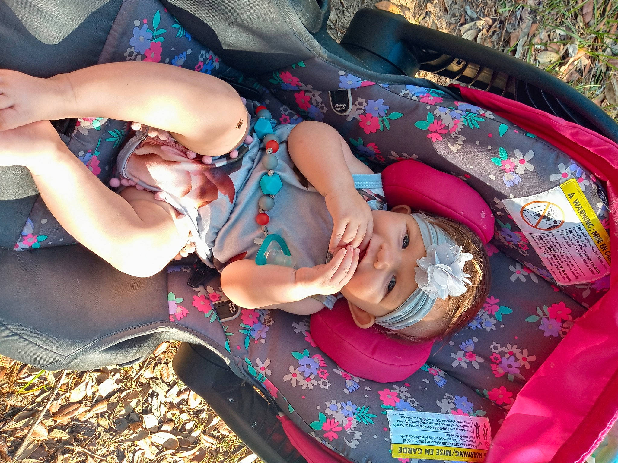 Kaitlyn joined the competition — help win amazing prizes! baby, baby_products, chest, child, fun, grass, happy, hat, headwear, human_leg, lap, leisure, mouth, pattern, person, pink, recreation, summer, thigh, toddler