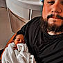 Samaël participe au concours pour gagner de l'argent avec cette photo : man, baby, newborn, blanket, sleeping, beard, tattoo, black_shirt, sink, bathroom, holding, comfort, rest, portrait, indoor, person, white_blanket, skin, relaxation, parent