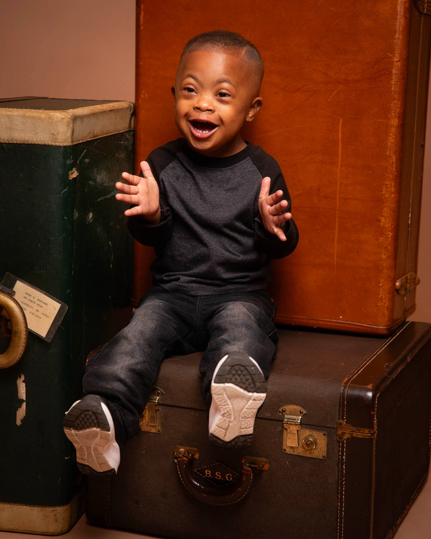 Jalil joined the competition — help win amazing prizes! arm, art, audio_equipment, box, child, face, flash_photography, foot, happy, head, human_leg, knee, person, room, sitting, smile, t_shirt, thigh, thumb, toddler